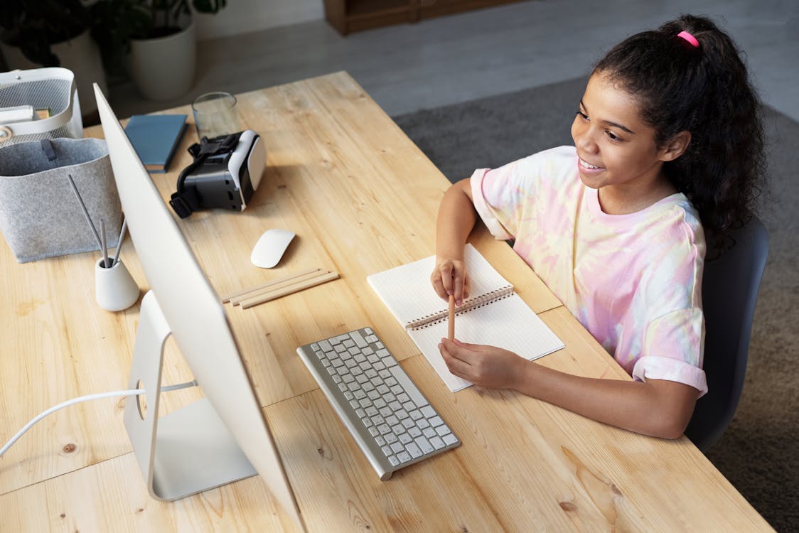 Child engaged in online teletherapy session